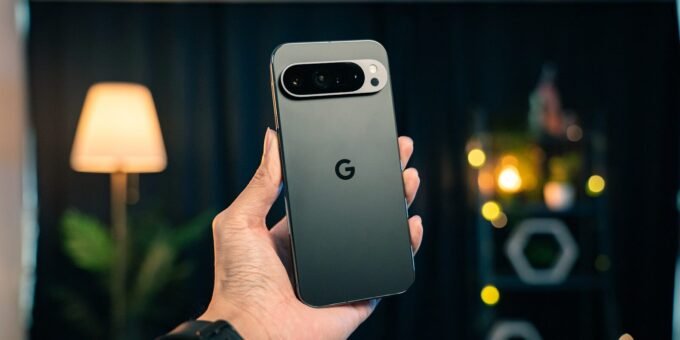 A person holding a cell phone in their hand